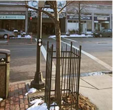 Panich APS at mid-block crossing, Newton, 
            Mass. APS should have been mounted on side of pole closest 
            to crosswalk, with arrow parallel to crosswalk rather
            than pointing up