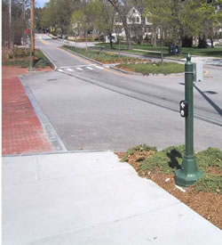 Panich APS on stub pole in Newton, Mass. 
            arrow oriented parallel to crosswalk.