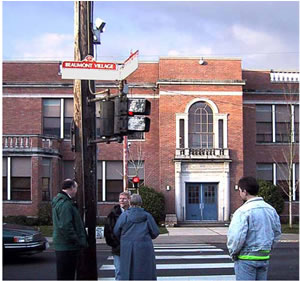APS mounted over 12 feet high on the pole broadcast speech messages at this location in Portland. 
            City engineers expressed concerns about intellibibility of the message.