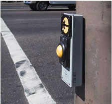 Vibrawalk pushbutton installed in Portland includes a locator tone.
            The arrow vibrates during the WALK interval and walk indication is provided from pushbutton or speaker mounted on the pedhead.