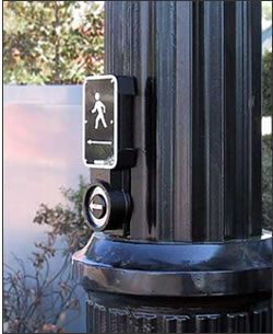 APS 
            is misaligned with the arrow pointing into the bushes. The fluted 
            pole made correct alignment more difficult. The installer said he 
            had to put it that way because he didn't have any shims; he didn't 
            seem to be concerned because it wasn't specified.