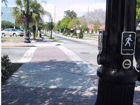 Two pushbuttons are located on fluted pole at this location with
			exclusive pedestrian phasing.  Tactile arrow of each device points in the direction of travel on the crosswalk.